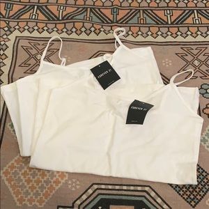 Two brand new white tank tops